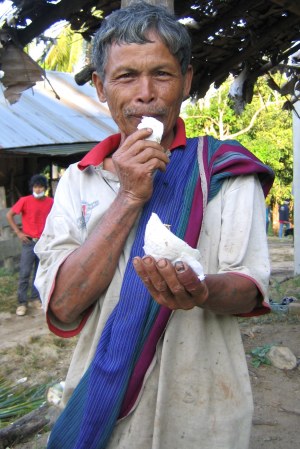 local-man-eating-coconut.jpg